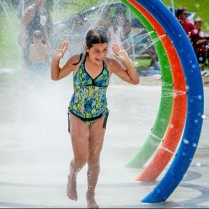 image showing child playing at a splash pad